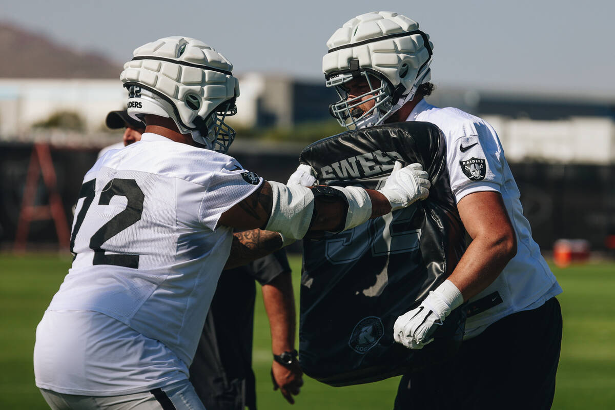 Raiders offensive tackle Jermaine Eluemunor (72) participates in a drill during training camp a ...