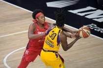 Washington Mystics center Alaina Coates (81) defends against Los Angeles Sparks forward Nneka O ...