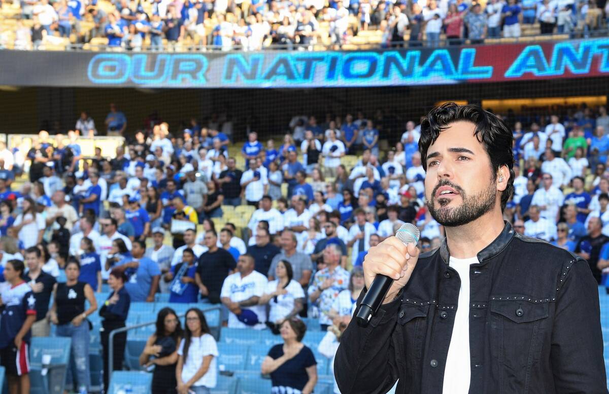 Vegas showman Frankie Moreno sings the national anthem at the L.A. Dodgers-Cincinnati Reds game ...