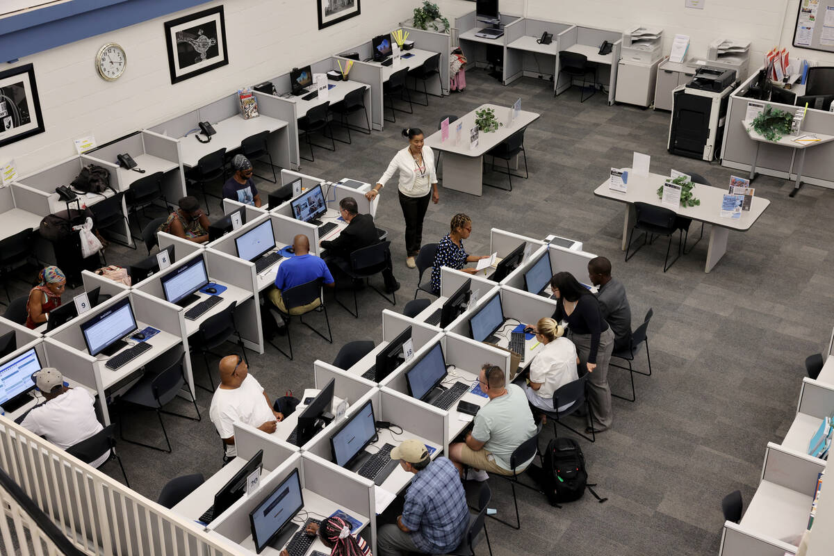 Job seekers fill out applications at EmployNV Career Hub in Las Vegas Thursday, July 27, 2023. ...