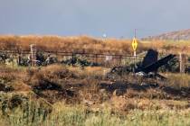 Charred remains of a Cessna lie near the landing approach at French Valley Airport, in Murrieta ...