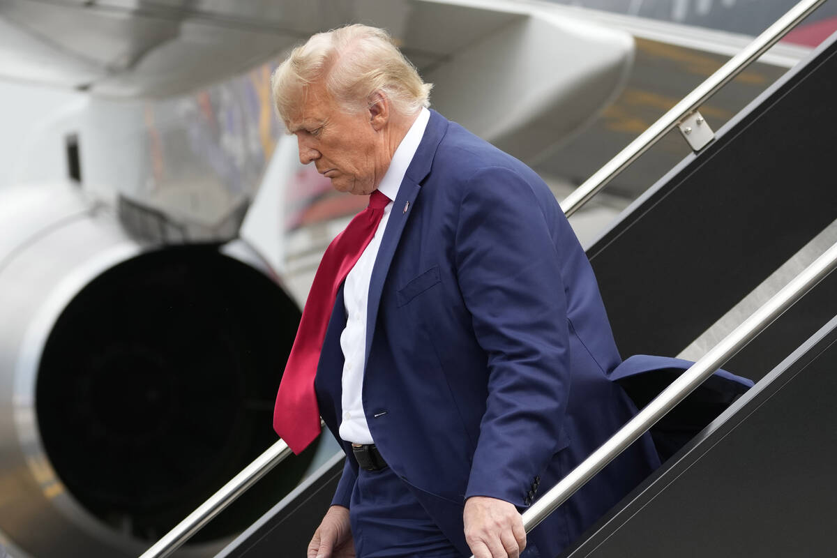 Former President Donald Trump arrives at Ronald Reagan Washington National Airport, Thursday, A ...