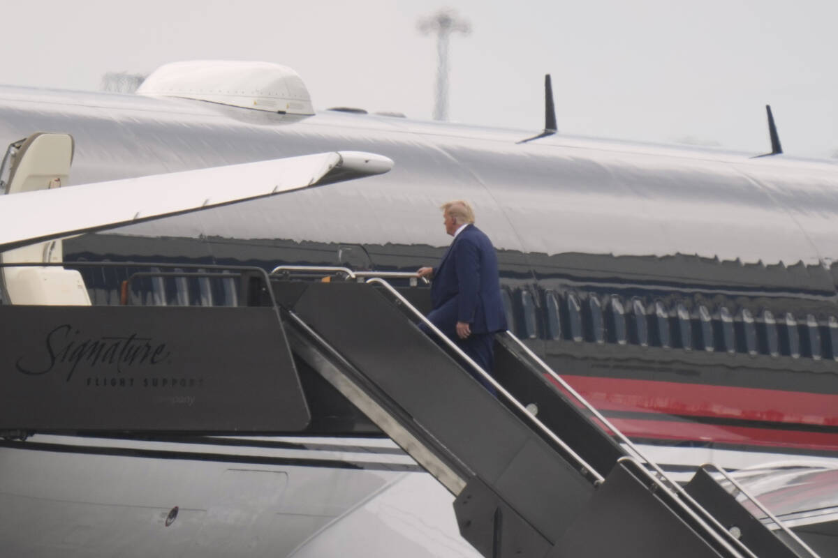 Former President Donald Trump boards his plane at Newark Liberty International Airport in Newar ...