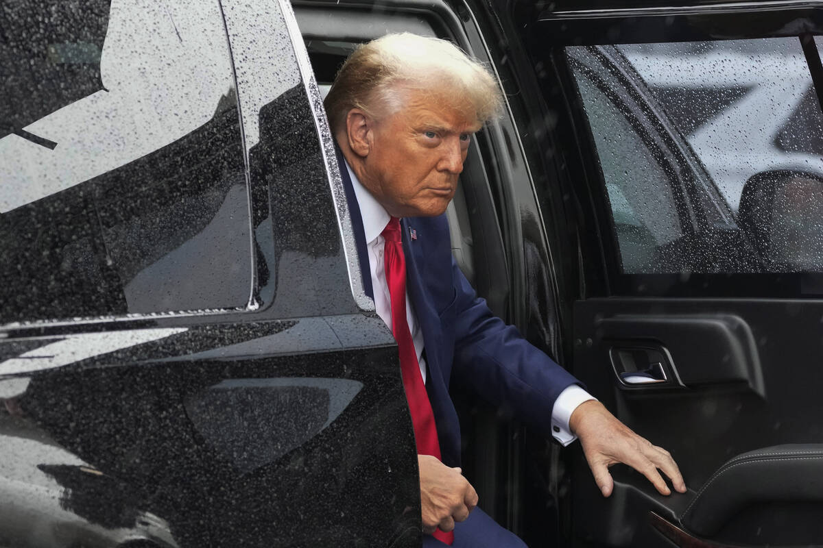 Former President Donald Trump arrives to board his plane at Ronald Reagan Washington National A ...