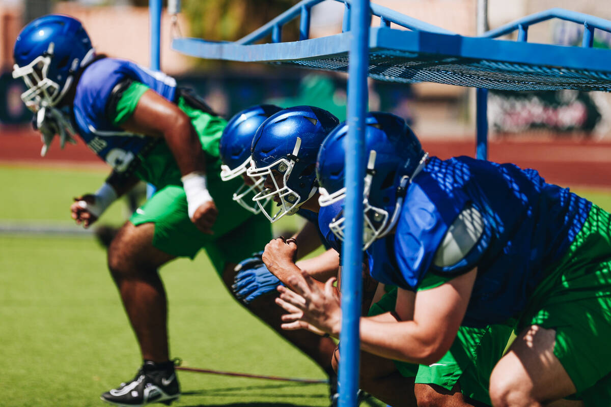 Green Valley football players run through a drill during practice at Green Valley High School o ...