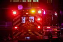 FILE - An ambulance with a patient inside rushes to the trauma emergency room at the Sunrise Ho ...