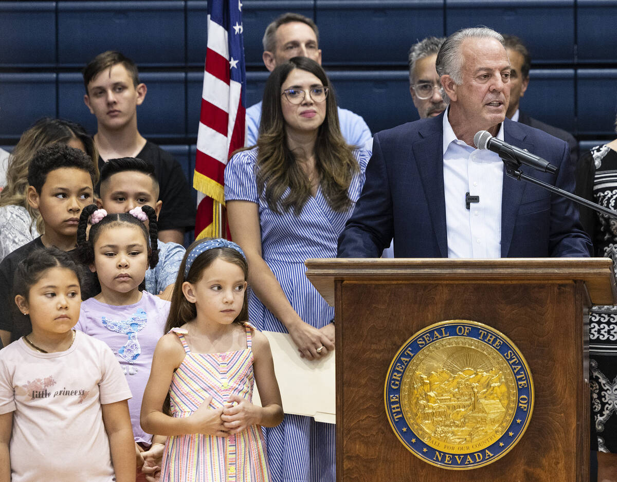 Gov. Joe Lombardo speaks during a "school choice" rally as Valeria Gurr, left, Nevada School Ch ...