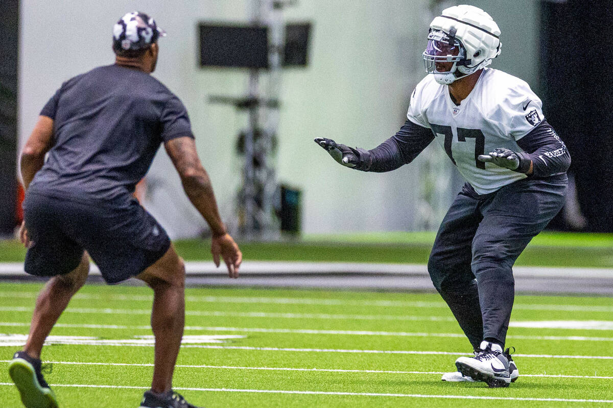 Raiders offensive tackle Thayer Munford Jr. (77) keeps his space rusher free during training ca ...
