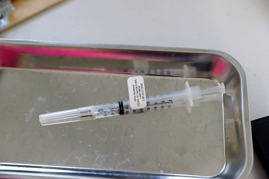 A Pfizer vaccine at a COVID-19 vaccination station at the Southern Nevada Health District in La ...