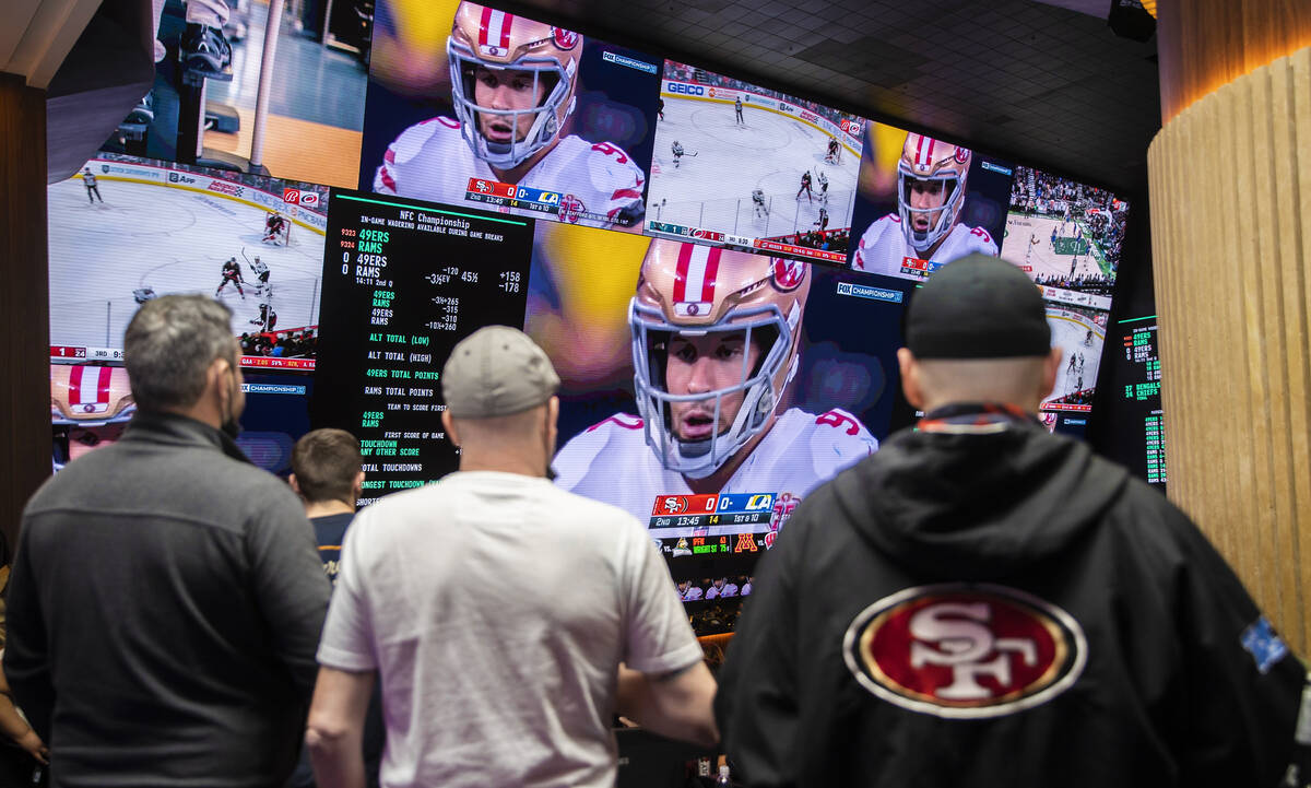 San Francisco 49ers fans watch the NFC Championship NFL football game against the Los Angeles R ...