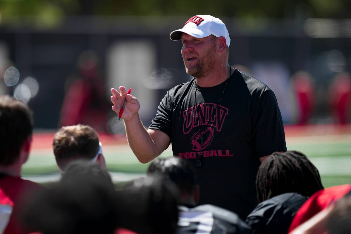 UNLV coach Barry Odom addresses the team after the first practice of fall camp Friday, Aug. 4, ...