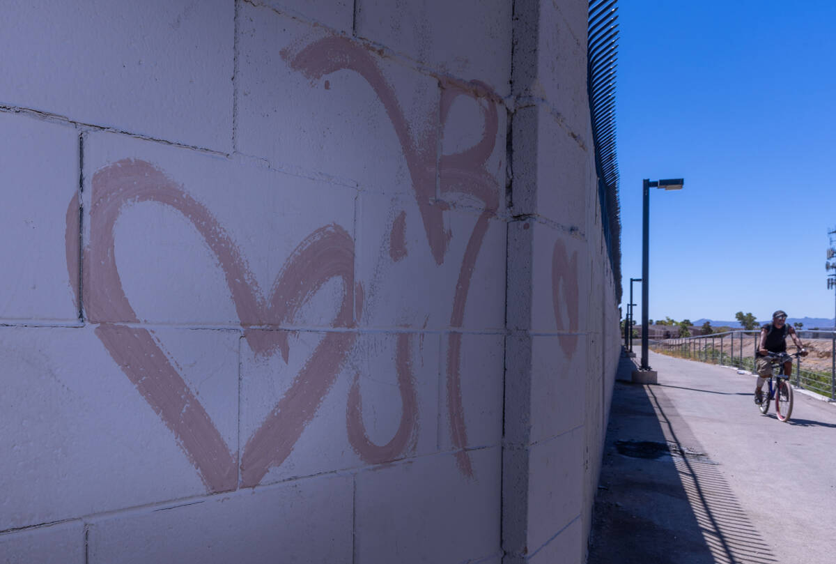 A heart is painted on the wall near where Angel Naranjo was killed on his minibike along a pave ...
