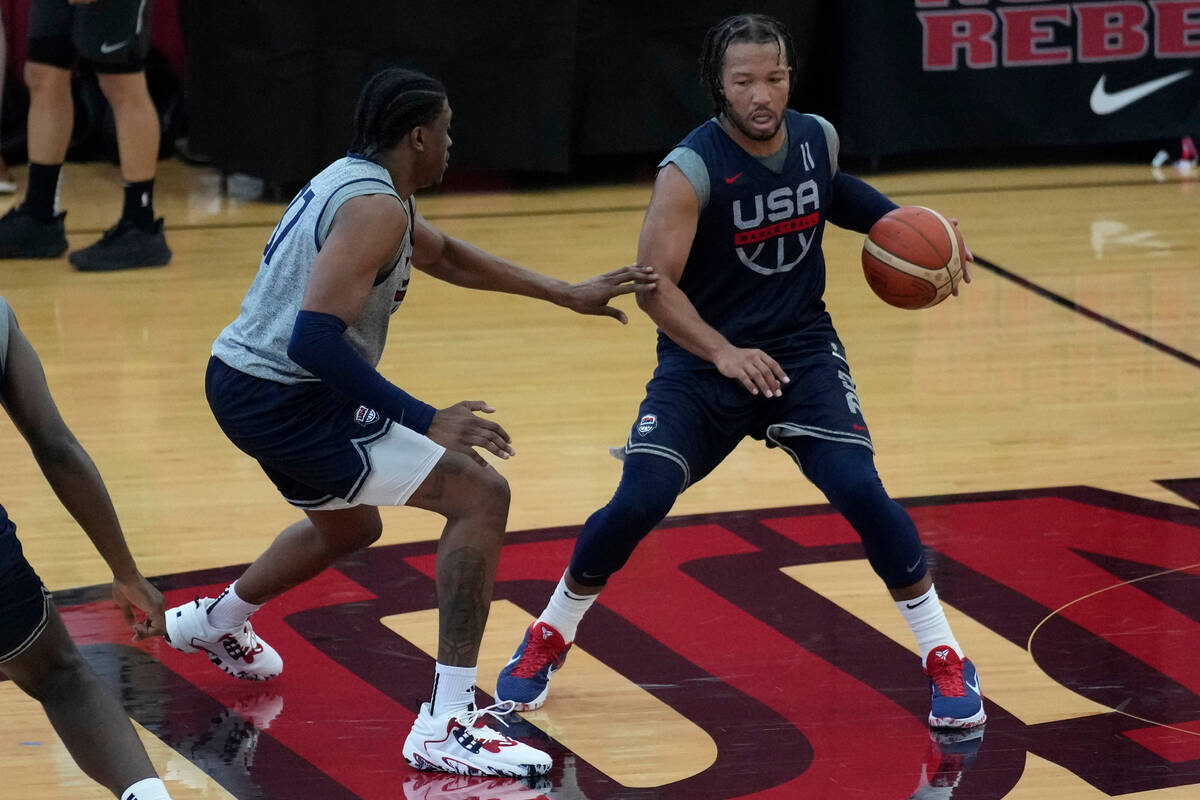Jalen Brunson of the New York Knicks, right, drives up the court during training camp for the U ...