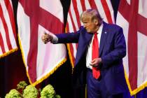 Former President Donald Trump gestures after speaking at a fundraiser event for the Alabama GOP ...