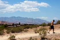 A man runs up the hill at Exploration Peak Park on Wednesday, May 27, 2020, in Las Vegas. (Chri ...