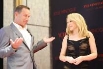 Michael Gruber, left, chief content officer of The Venetian, and Kylie Minogue speak at an even ...