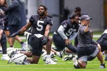 Raiders linebacker Divine Deablo (5) stretches as part of warm ups during training camp at the ...