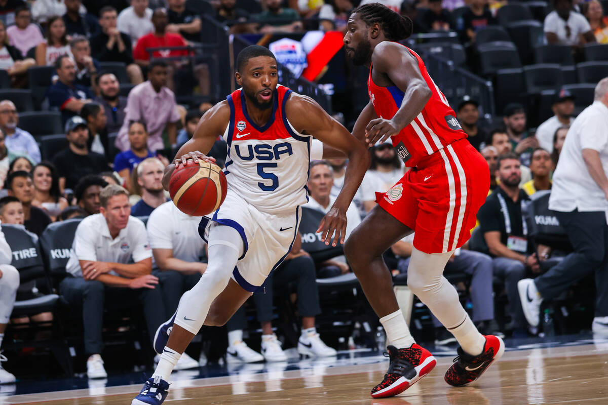 USA Basketball Men’s National Team forward Mikal Bridges (5) moves the ball past a Puert ...