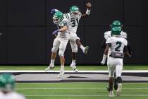 Rancho's Saied Koroma (31) celebrates a touchdown with teammate Victor Arellano (80) during a t ...