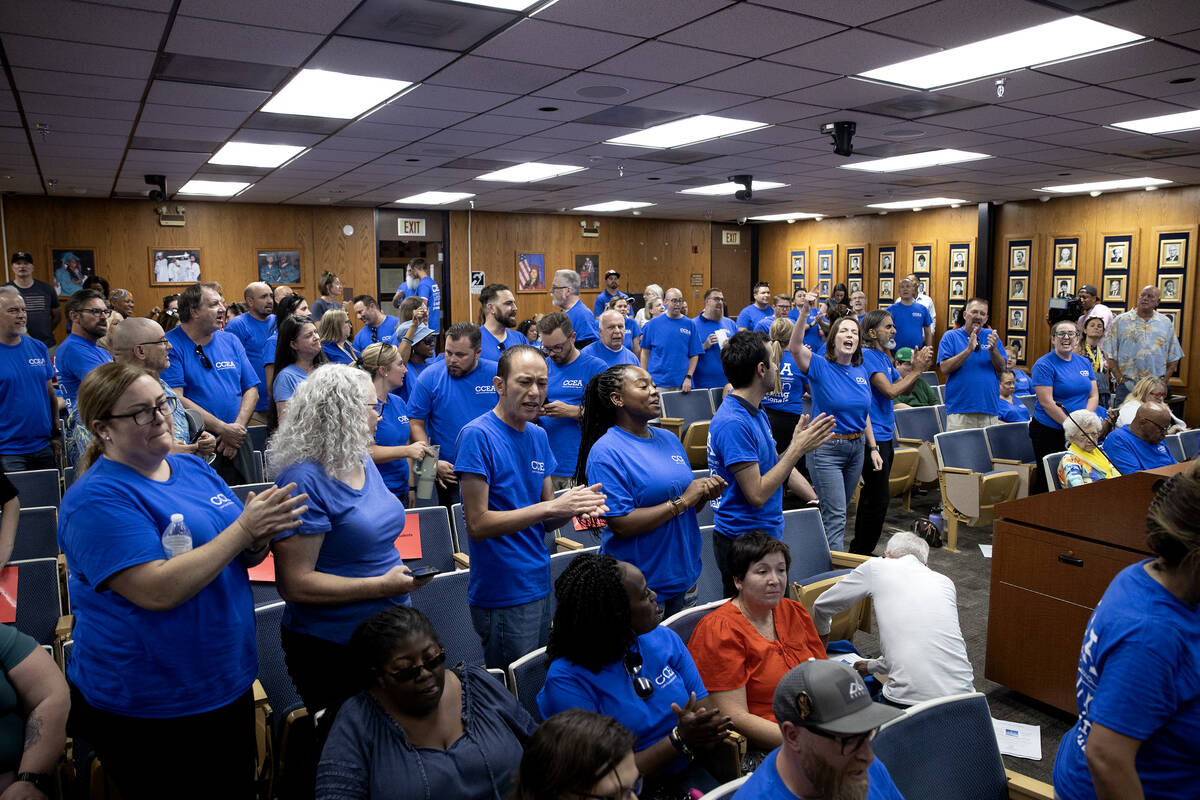 Clark County Education Association teachers union members chant for the CCSD Board of Trustees ...