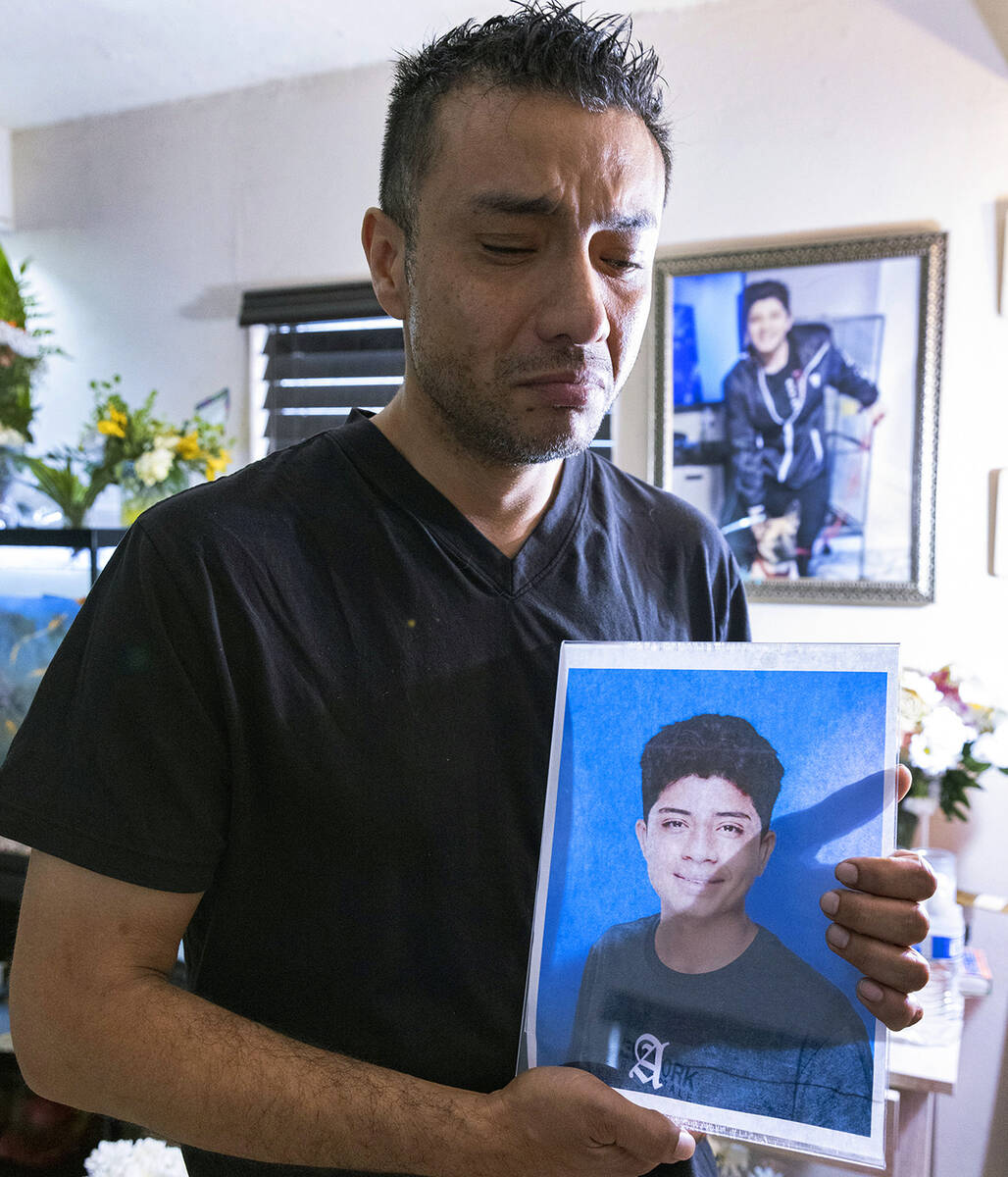 Rudolfo Naranjo holds a photograph of his son, Angel, as he poses for a photo at his Las Vegas ...