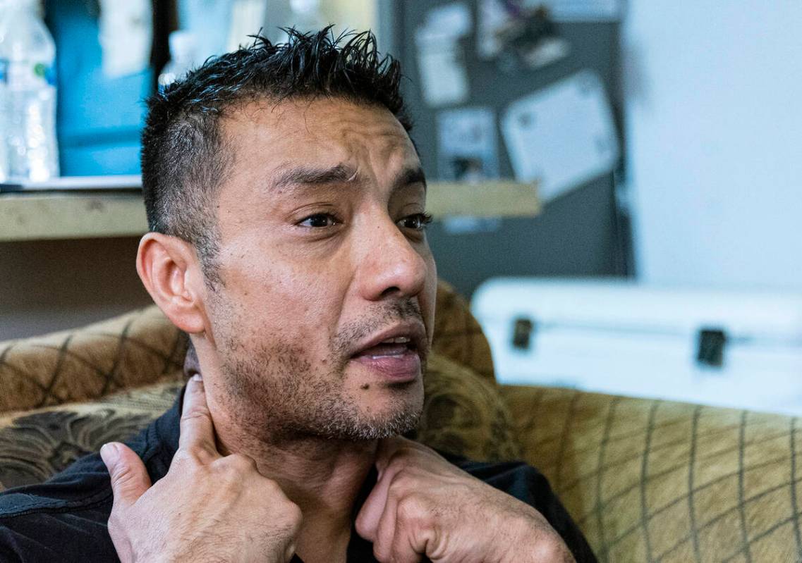 Rudolfo Naranjo demonstrates how a cable struck and killed his son Angel, during an interview ...
