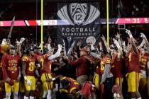 Southern California players and coaches celebrate after defeating Stanford 31-28 in the Pac-12 ...