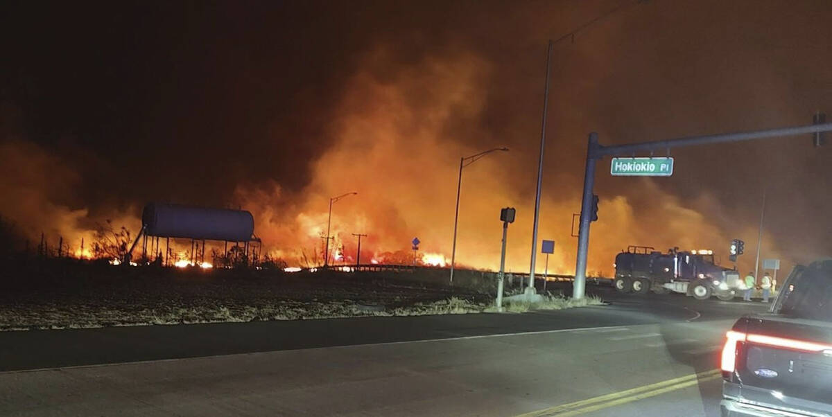 This photo provided by County of Maui shows fire and smoke filling the sky from wildfires on th ...