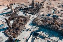 An aerial view shows large piles of debris at the scene where a fire destroyed an apartment com ...