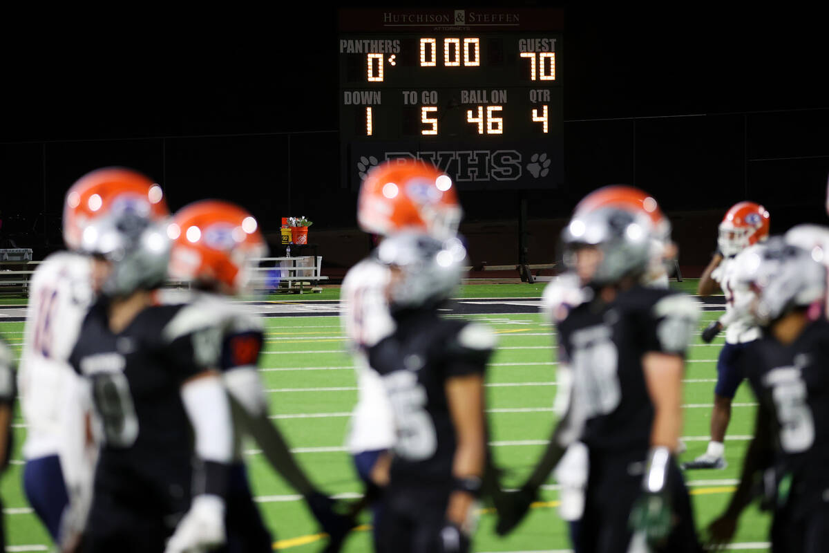 The scoreboard show Bishop Gorman winning the game 70-0 against Palo Verde for the final score ...