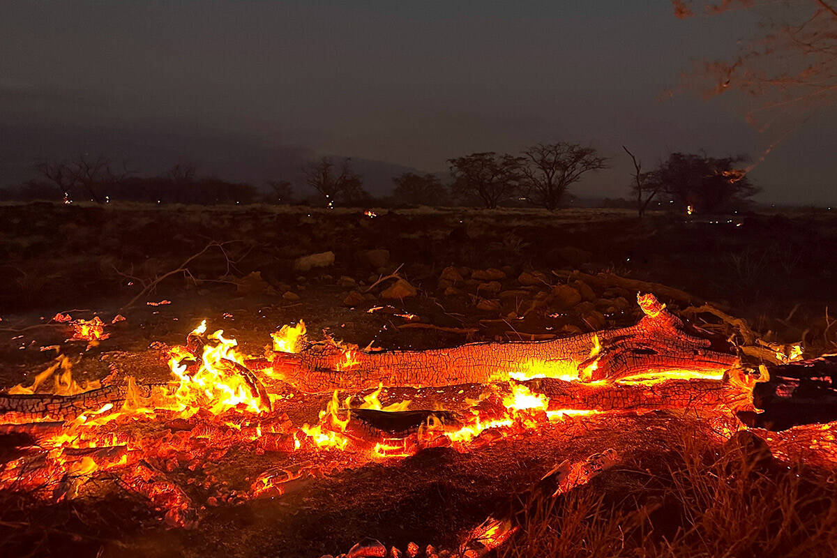 A wildfire burns in Kihei, Hawaii late Wednesday, Aug. 9, 2023. Thousands of residents raced to ...