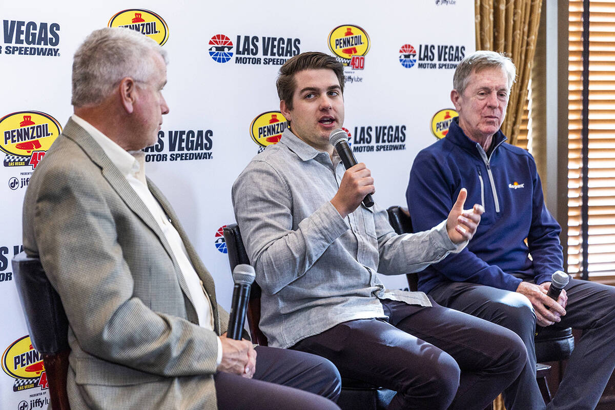 (LtoR) Chris Powell, president and general manager of the Las Vegas Motor Speedway listens to N ...