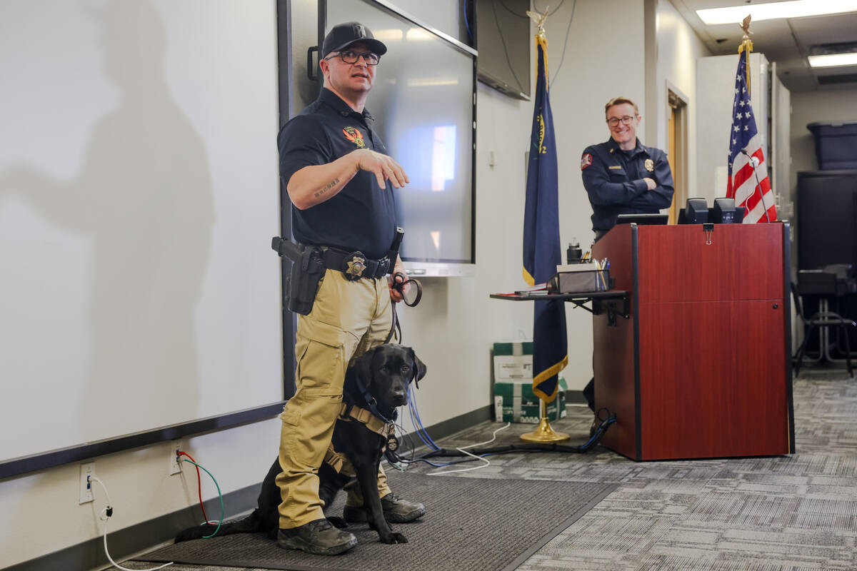 Ron Mauro, a fire investigator and ignitable liquid detection K-9 handler, addresses the media ...