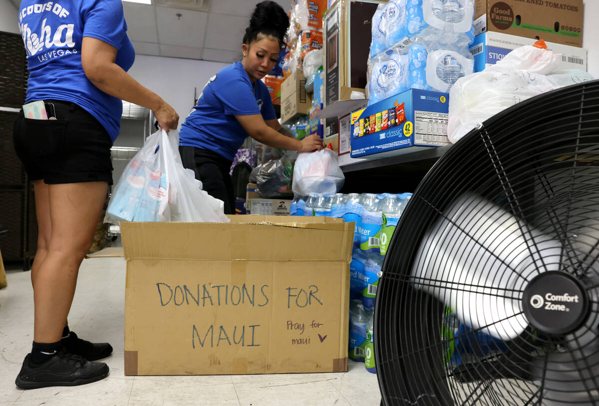 Shanice Walter, right, and her mother Shai Walter organize donations for victims of the Maui fi ...