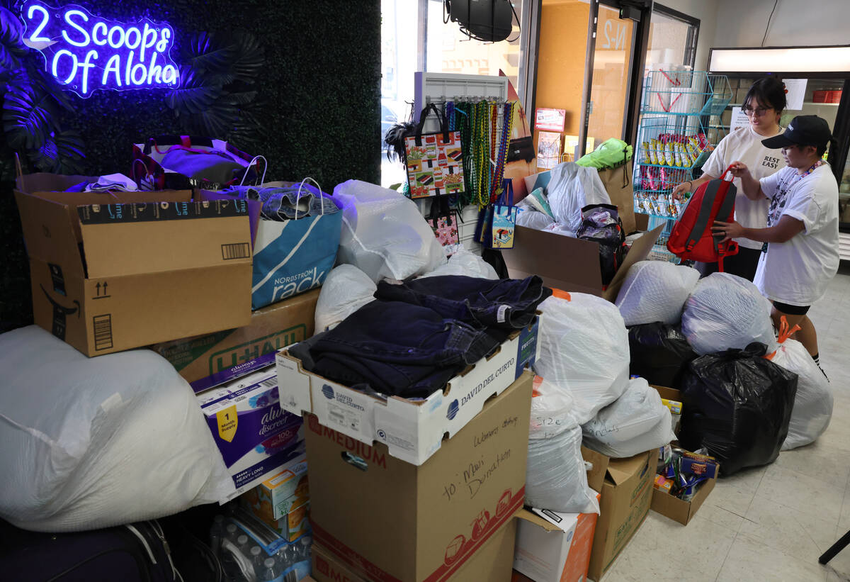 Jewelyn Garcia, right, and Maria Cabrera of Las Vegas drop off donations for victims of the Mau ...