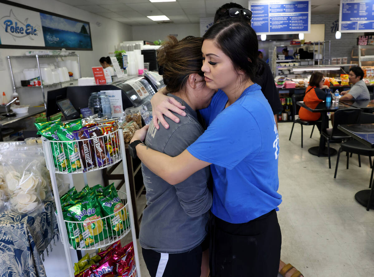 Alijah Walter, right, hugs Ennah Cabading, who lost her family’s Lahaina home in the Maui fir ...