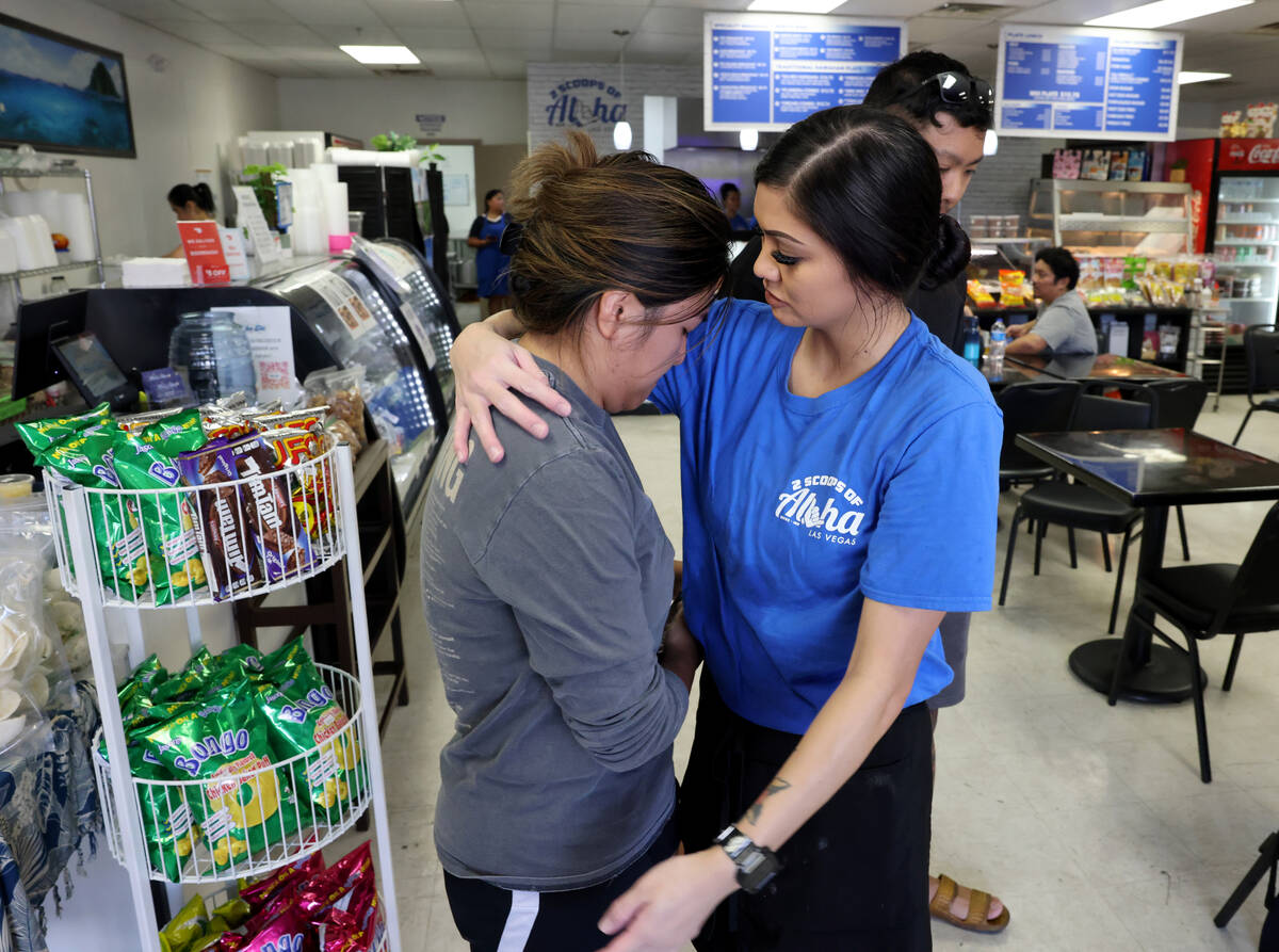 Alijah Walter, right, hugs Ennah Cabading, who lost her family’s Lahaina home in the Maui fir ...