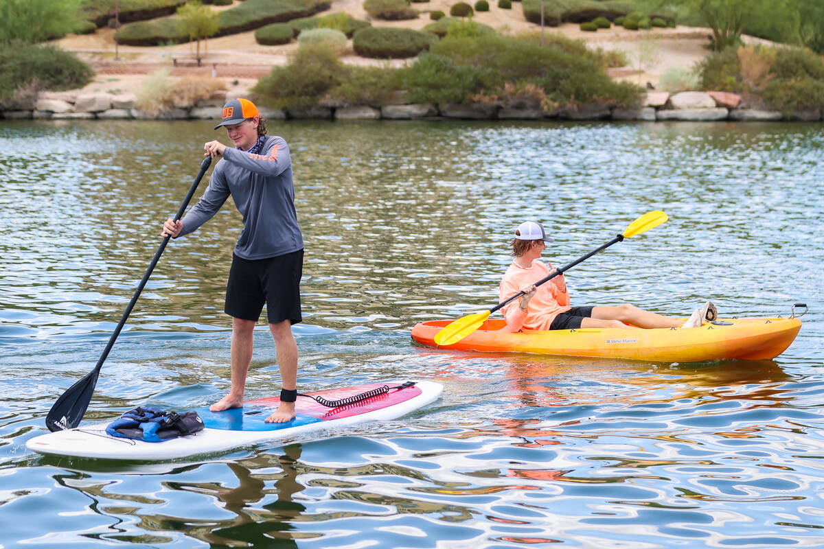 Austin Weible, left, and Ian Dross rent out paddle boards and kayaks through Lake Las Vegas Wat ...
