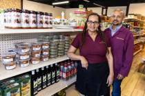 Melkam Ethiopian Market co-owners Eleni Belete and her husband Mehari Merhe pose for a photo a ...