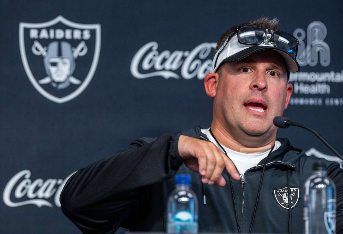 Raiders head coach Josh McDaniels answers a question in a press conference during training camp ...