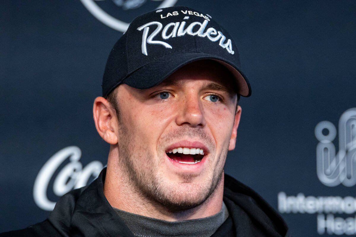 Raiders linebacker Robert Spillane (41) answers a question in a press conference during trainin ...