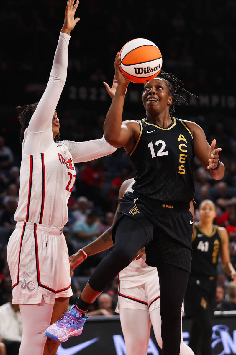 Las Vegas Aces guard Chelsea Gray (12) makes a layup during a WNBA game against the Washington ...