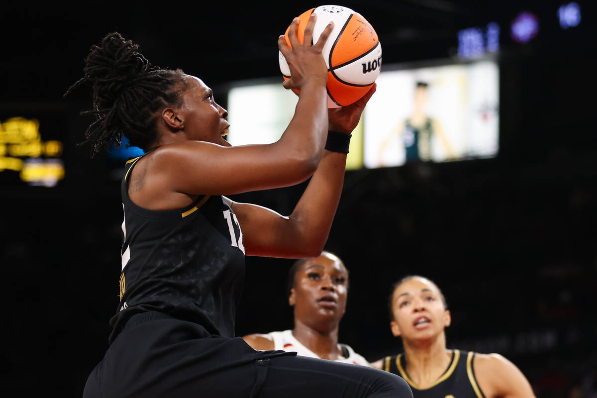 Las Vegas Aces guard Chelsea Gray (12) goes in for a layup during a WNBA game against the Washi ...