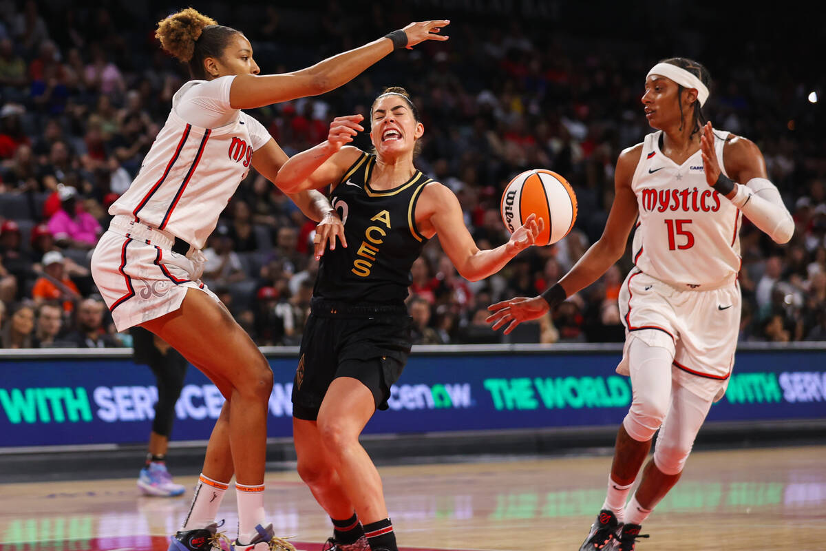 Las Vegas Aces guard Kelsey Plum (10) gets the ball knocked out of her hands by Washington Myst ...