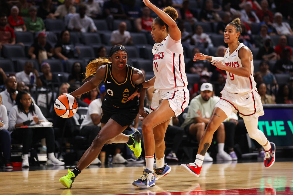 Las Vegas Aces guard Jackie Young (0) drives the ball to the basket during a WNBA game against ...