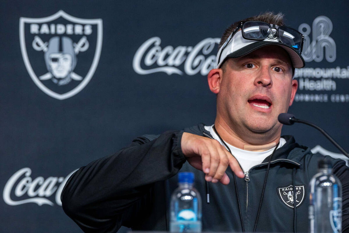 Raiders head coach Josh McDaniels answers a question in a press conference during training camp ...