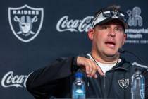 Raiders head coach Josh McDaniels answers a question in a press conference during training camp ...
