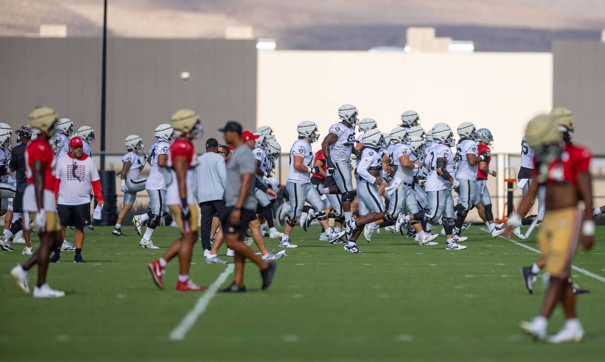 Raiders in warmups during training camp before scrimmaging the San Francisco 49ers at the Inter ...