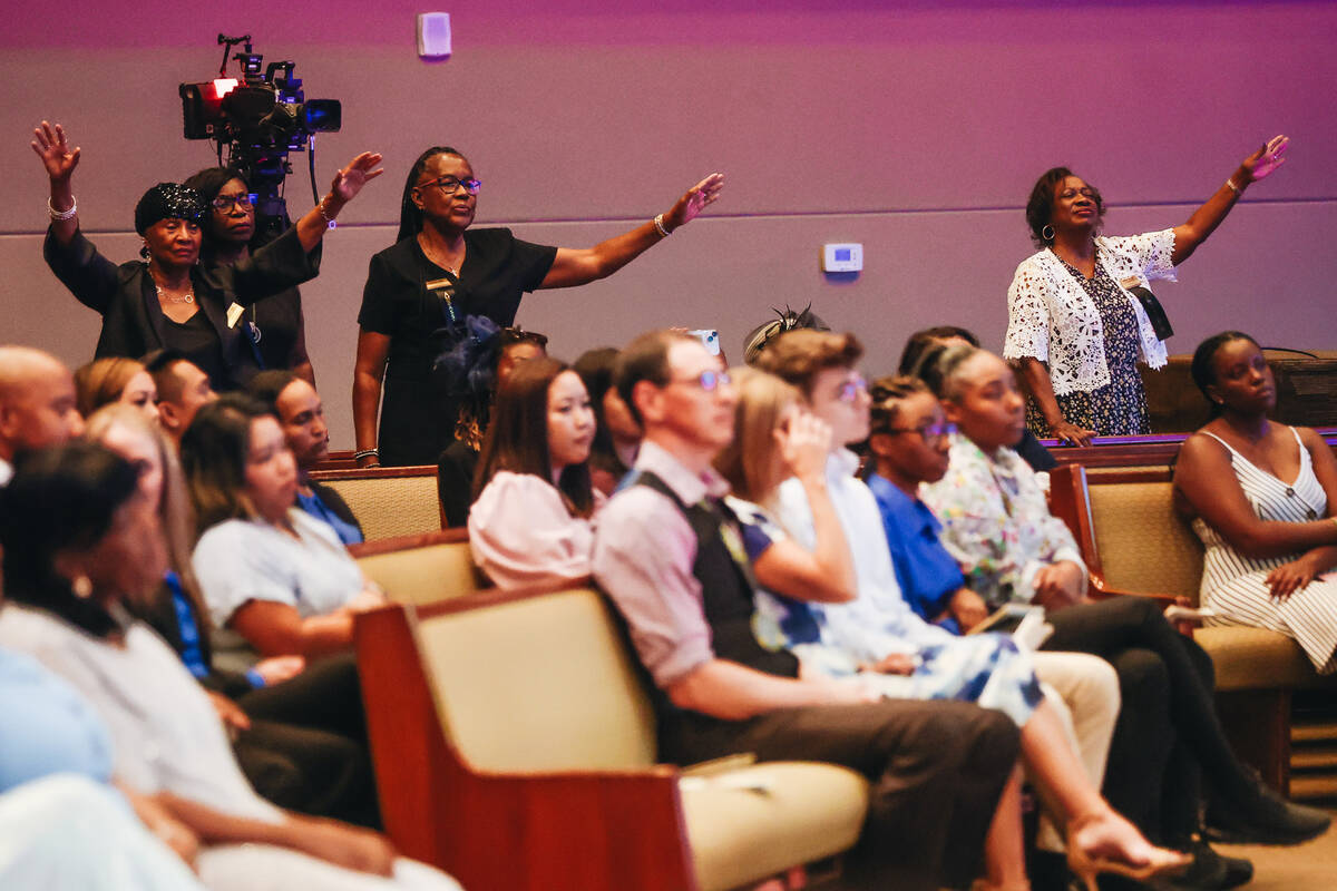 People attending the celebration of life service for Jessica Rosalie Rhodes take in the music d ...