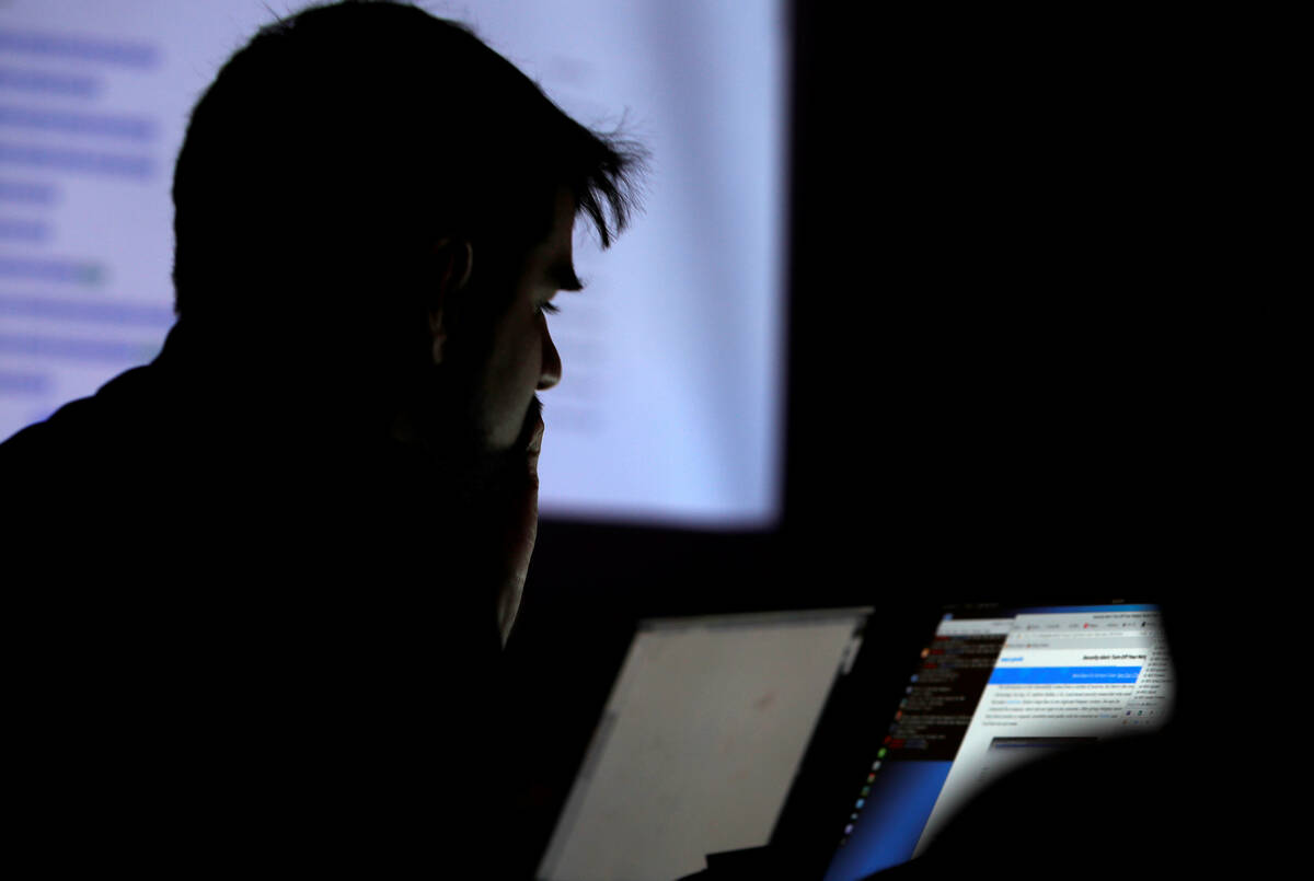 A man takes part in a hacking contest during the Def Con hacker convention in Las Vegas on July ...